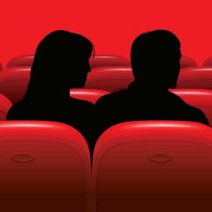 An illustration of sitting in a movie theatre among rows of red seats. 