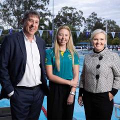 An image of Executive Dean of UQ's Faculty of Health and Behavioural Sciences Professor Bruce Abernethy, UQ student and Paralympic champion Lakeisha Patterson OAM, and Paralympics Australia Chief Executive Catherine Clark at the UQ Aquatic Centre.