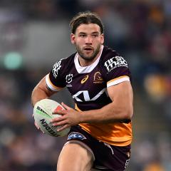 An image of Pat Carrigan running with the ball while playing for the Brisbane Broncos.