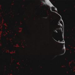 An image of vampire on a dark background with blood splattered across the image.