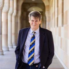 An image of Professor Victor Nurcombe among the cloisters of UQ's Great Court.