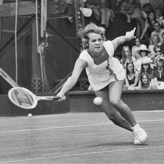 Evonne Goolagong stretches for a forehand on the court during a match at Wimbledon in 1973.
