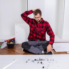 Man looking confused at building instructions