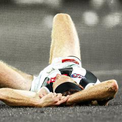 Nathan Murphy on the ground after a head knock against Adelaide in 2023. 