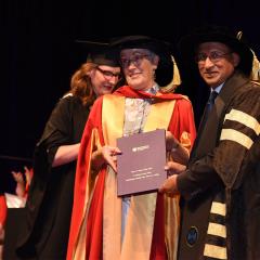 An image of Dr Beth Woods with UQ Chancellor Peter Varghese AO after receiving an Honorary Doctorate from UQ in 2021.