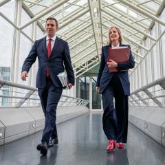 An image of Treasurer Jim Chalmers and Finance Minister Katy Gallagher arriving at Parliament House before delivering the Albanese government's first budget.