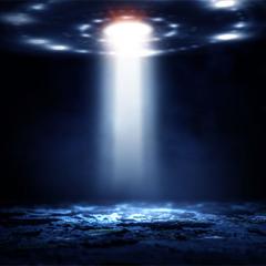 An image of a UFO with beams coming out of the bottom