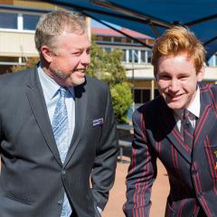 This is an image of Toowoomba State High School principal Tony Kennedy with a student