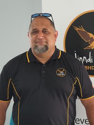 headshot of Will Davis OAM wearing a black t-shirt