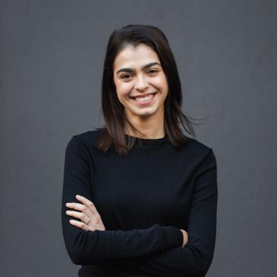 Georgia wearing a black long sleeve top and smiling to the camera