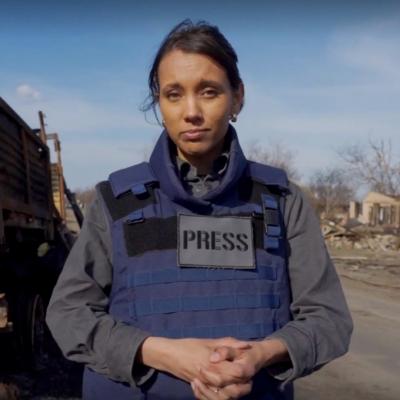 Isabella reporting from Ukraine in blue and grey Press uniform