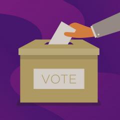 Hand placing a vote in a ballot box