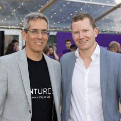 Daniel Wessels and Nimrod Klayman standing together smiling towards the camera.