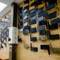 Multiple lecture theatre desks used for the wall display in the Physiology building at UQ St Lucia.