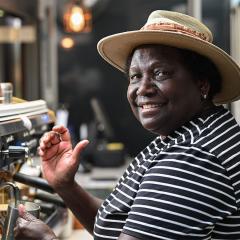 An image of Regie Narara making a coffee in the Coffee Pod at UQ's Gatton campus.
