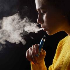 A young girl vaping