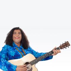 Image of a First Nations person with long curly hair, a bright blue long-sleeve shir and red lipstick - they are looking at the camera, smiling and holding an acoustic guitar.