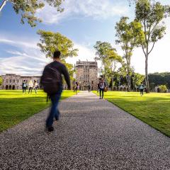 Students walking in UQ's Great Court
