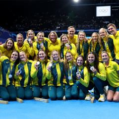 The Australian women's water polo team celebrate after winning a silver medal in Paris. Image: Quinn Rooney/Getty Images