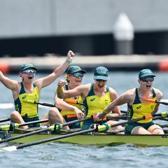 The Australian women's quadruple sculls team, featuring UQ graduates Ria Thompson (far left) and Caitlin Cronin (far right), celebrate after claiming bronze at the 2020 Tokyo Olympics. 