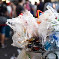 An image of a bin filled to the brim with plastic bags and other soft plastics.