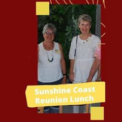Image of two women in white blouse tops smiling at the camera