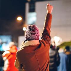 An image of a woman leading a protest