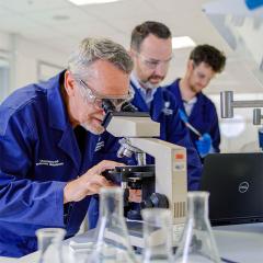 An image of UQ COVID-19 vaccine project co-leader Professor Paul Young, project director Professor Trent Munro, and project co-leader Associate Professor Keith Chappell in the lab.