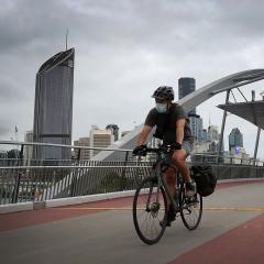 A man rides to work in the Brisbane CBD.