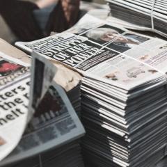 An image of a pile of newspapers