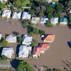 Aerial shot of a flooded suburb with water up to the windows